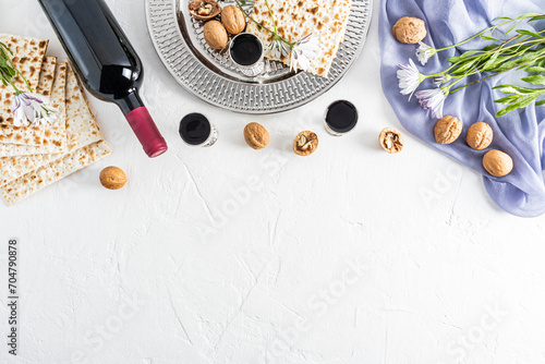 Concept of the Jewish holiday of Passover. Beautiful background with traditional holiday treats on white. A copy of the space. Flat layout. border.