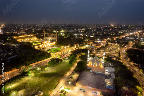 Aerial drone shot of lucknow building bada imambada   mosque with night lights   road at night with cars