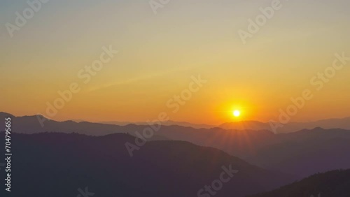 sunset time lapse. Big bright Yellow sun moves down.