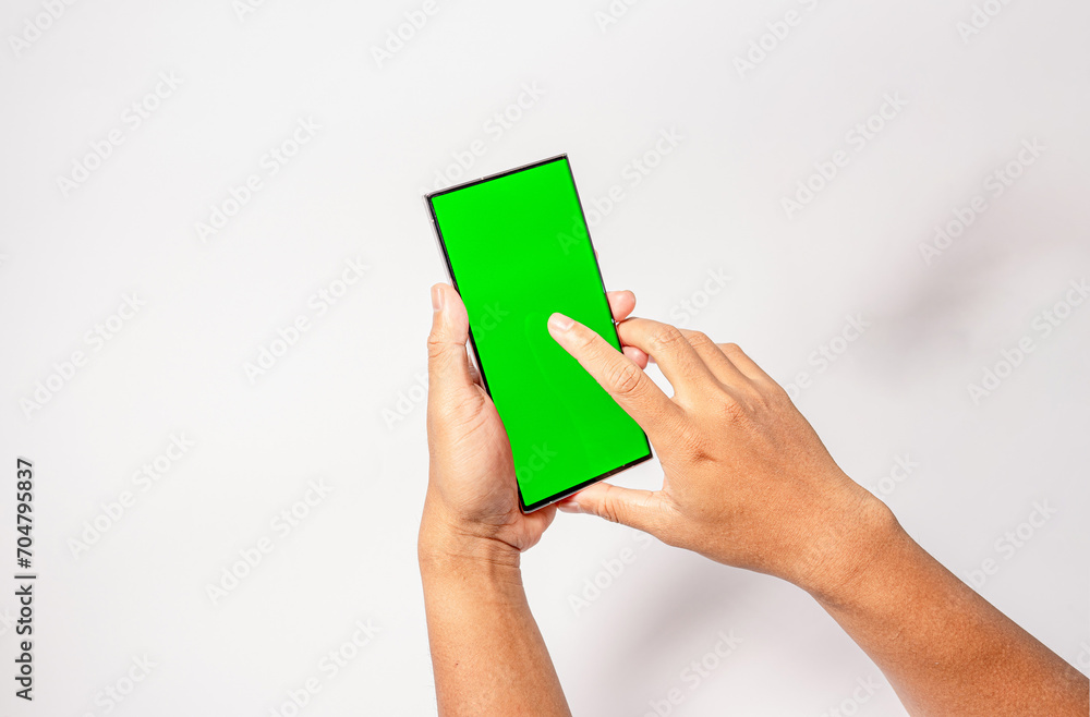 Mockup of man hand holding the black android smartphone with green screen white background Mockup of man hand holding the black android smartphone with green screen white background