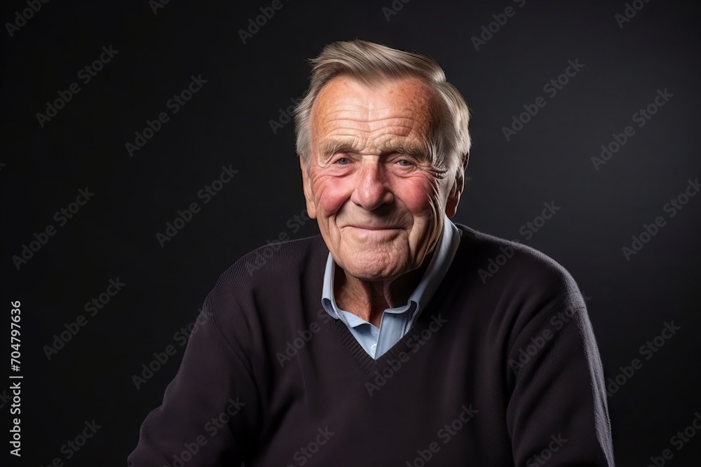Portrait of an elderly man on a dark background. Studio shot. Portrait of an elderly man on a dark background. Studio shot.