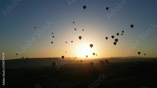 Aerial view of back light amazing hot air balloons in Cappadocia - Turkey. photo