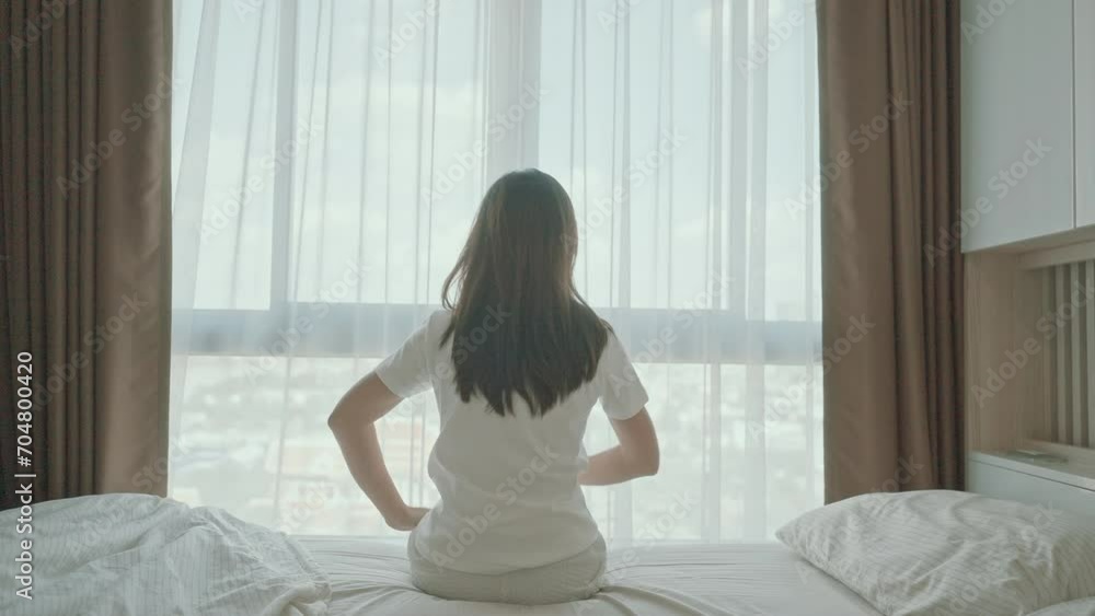 Woman having arm pain during sitting on bed at home, muscle injury and ache after waking up. Health and medical concept Woman having arm pain during sitting on bed at home, muscle injury and ache after waking up. Health and medical concept