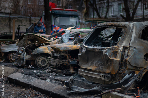 Dnepr, Ukraine – January 6: Russian drones attacked the Dnieper. Burnt and damaged cars in the Dnieper. Utility services clean up the aftermath of the attack on the city.