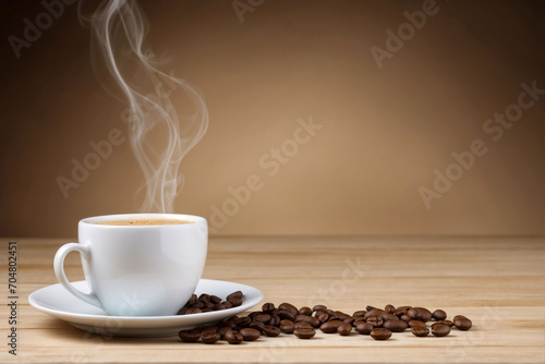 Arrangement of coffee beans and coffee cup with space for copy