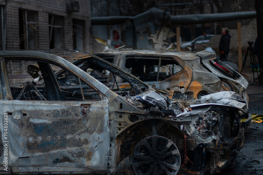 Dnepr, Ukraine – January 6: Russian drones attacked the Dnieper. Burnt and damaged cars in the Dnieper. Utility services clean up the aftermath of the attack on the city. Dnepr, Ukraine – January 6: Russian drones attacked the Dnieper. Burnt and damaged cars in the Dnieper. Utility services clean up the aftermath of the attack on the city.