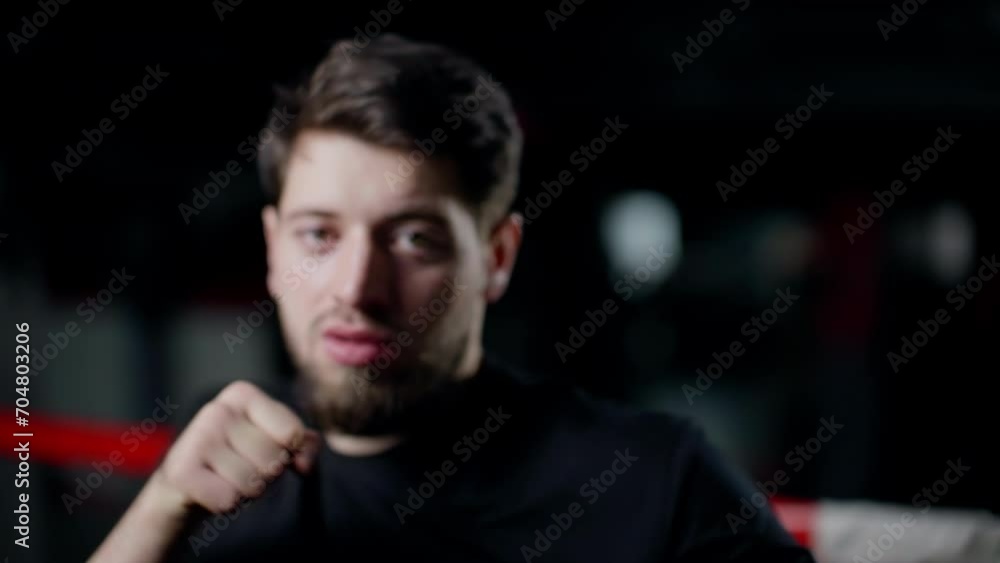 Punches and elbow strikes. Athletic men's training. A man punches the camera in a boxing ring. Slow motion. Punches and elbow strikes. Athletic men's training. A man punches the camera in a boxing ring. Slow motion.