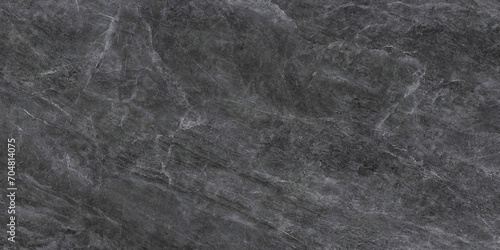 Dark grey black slate background or texture. Close up of natural stone wall.