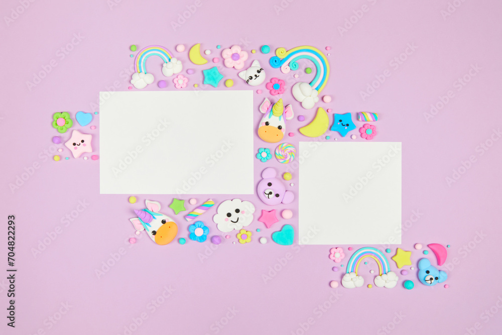 Two blank white cards on pastel purple background with frame of cute kawaii air plasticine handmade cartoon animals, rainbows. Empty photo frames, baby's photo book, scrapbooking design template Two blank white cards on pastel purple background with frame of cute kawaii air plasticine handmade cartoon animals, rainbows. Empty photo frames, baby's photo book, scrapbooking design template