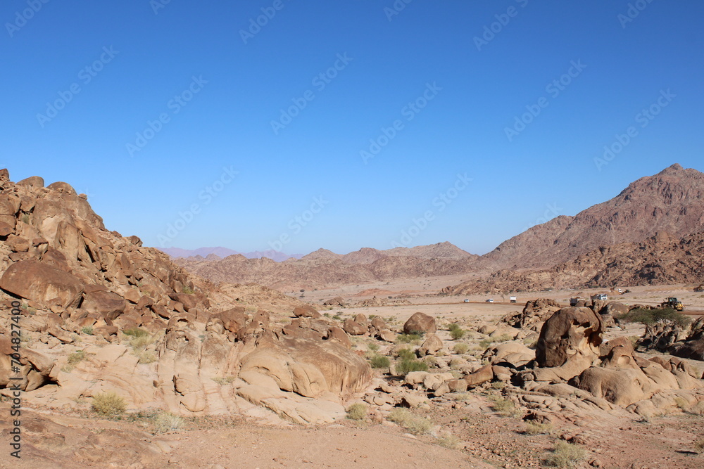 A beautiful daytime view of the mountain range adjacent to Split Rock in Tabuk, Saudi Arabia. A beautiful daytime view of the mountain range adjacent to Split Rock in Tabuk, Saudi Arabia.