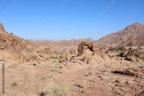 A beautiful daytime view of the mountain range adjacent to Split Rock in Tabuk, Saudi Arabia.