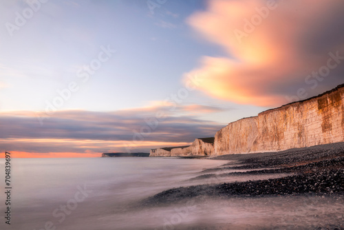 January sunset high tide at Birling gap and the seven sisters cliffs on the east Sussex coast south east England UK photo