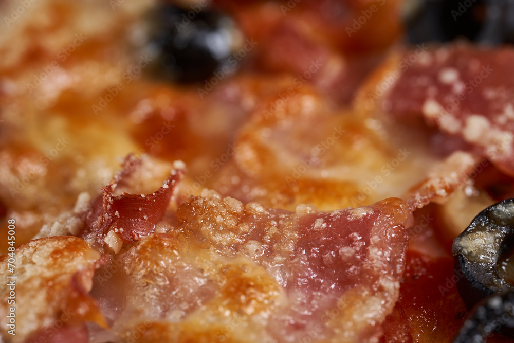 Macro shot showing details with melted parmesan on a pizza Macro shot showing details with melted parmesan on a pizza
