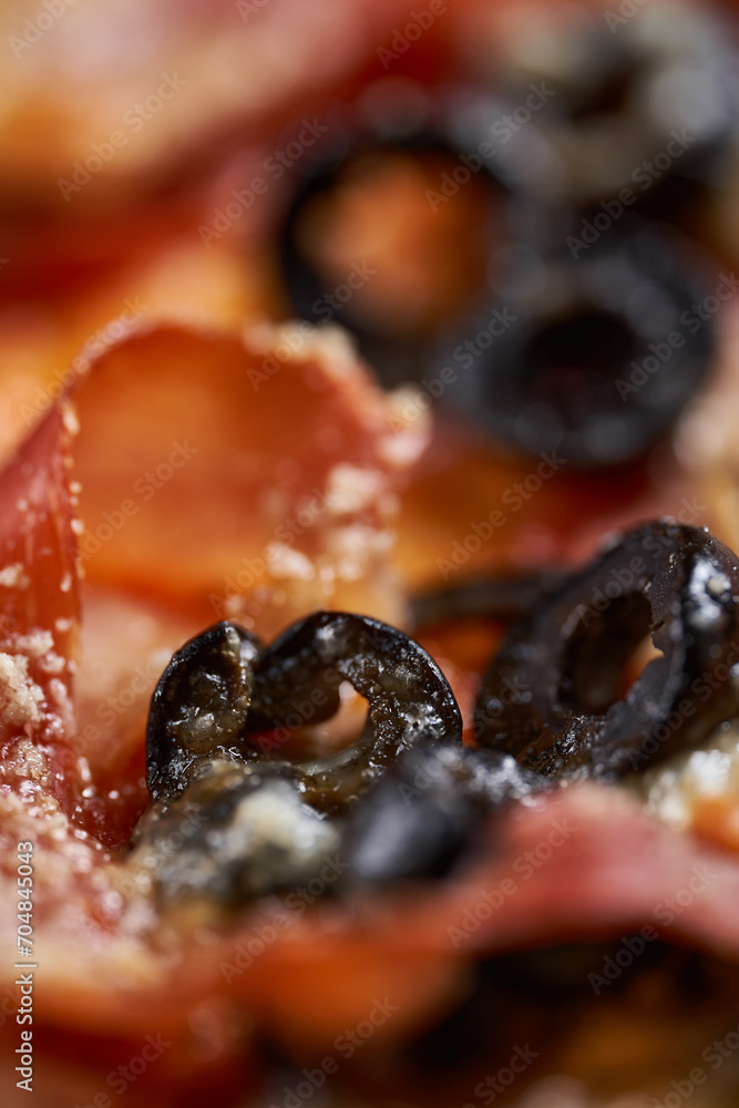 Macro shot showing details with melted parmesan on a pizza Macro shot showing details with melted parmesan on a pizza