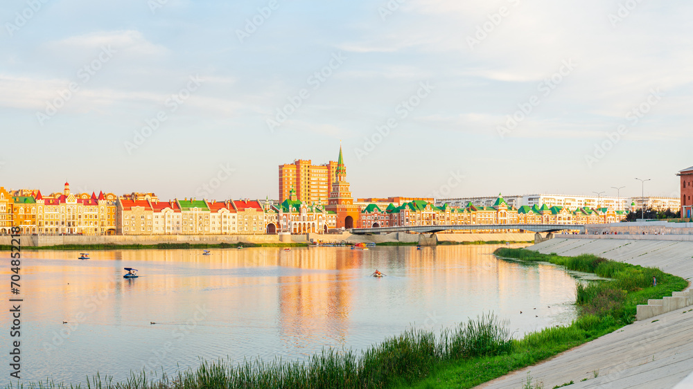 Yoshkar-Ola, Russia. Panorama of the city center. Malaya Kokshaga river, Bruges embankment, Theater bridge, Spasskaya tower
