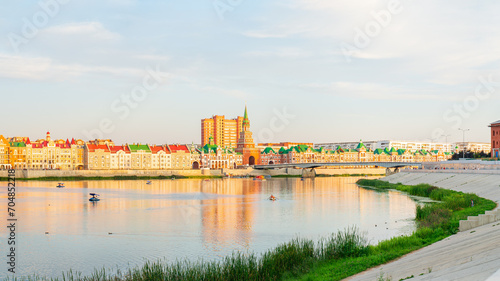 Yoshkar-Ola, Russia. Panorama of the city center. Malaya Kokshaga river, Bruges embankment, Theater bridge, Spasskaya tower photo