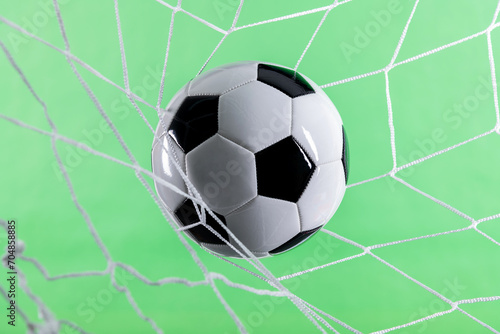 Soccer ball goal success on green background
