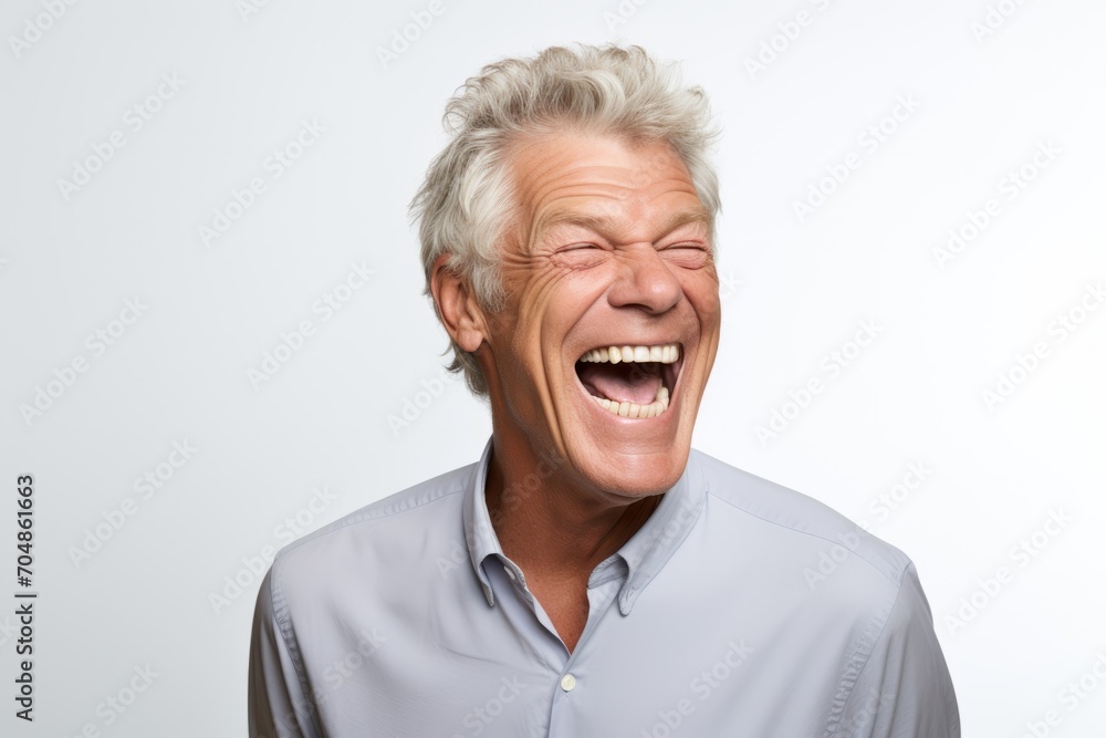 Portrait of a senior man laughing. Isolated on white background. Portrait of a senior man laughing. Isolated on white background.