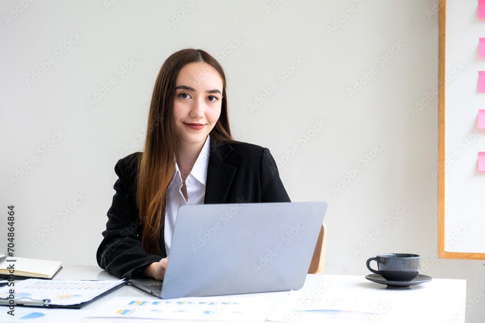 Businesswomen bookkeeper hand use laptop analysis the graph for Setting challenging business goals and ready to achieve target at home office Businesswomen bookkeeper hand use laptop analysis the graph for Setting challenging business goals and ready to achieve target at home office