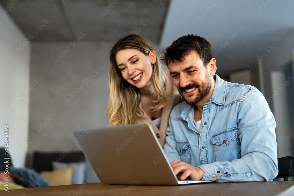 Portrait of success business people working together in home office. Couple teamwork startup concept Portrait of success business people working together in home office. Couple teamwork startup concept