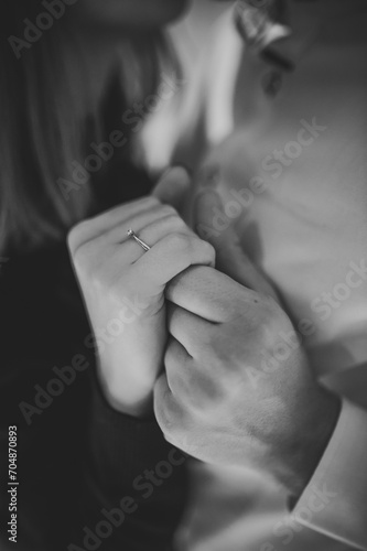 Marriage proposal. Will you marry me. She said yes. A couple hand with wedding ring. Love concept. Elegant template for design for Valentine's Day. Engagement ring. Black and white photo.