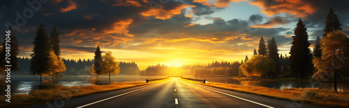 Country road and mountain in summer at sunset.