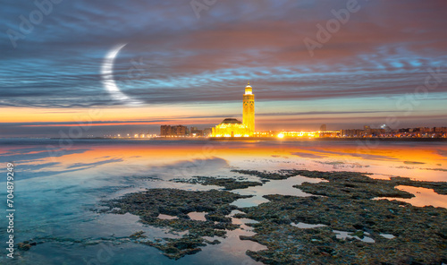Great Hassan II mosque with crescent at dusk - Casablanca, Morocco