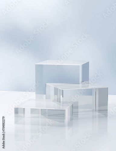 Three modern transparent cuboid podium, geometric pedestal on white counter, dappled light on blue wall. Luxury cosmetic, skincare, beauty, body care, treatment, fashion product display background 3D