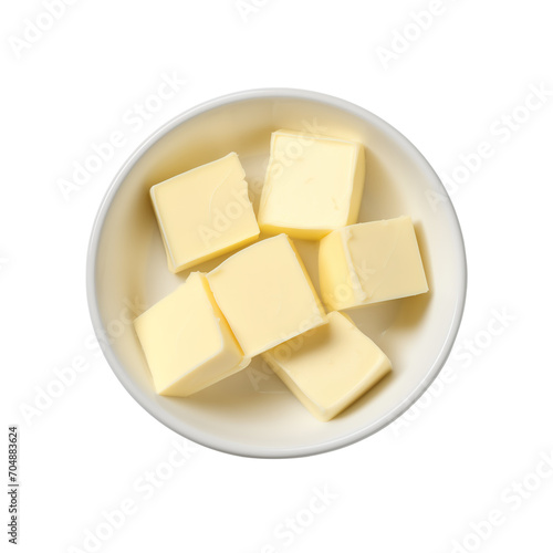 Bowl with butter cubes on white background