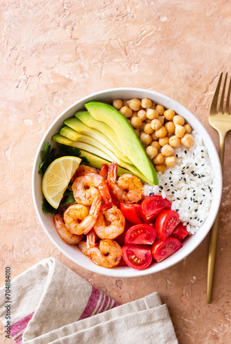 Bowl with rice, shrimp, avocado, tomato, chickpeas and lime. Healthy eating. Diet.