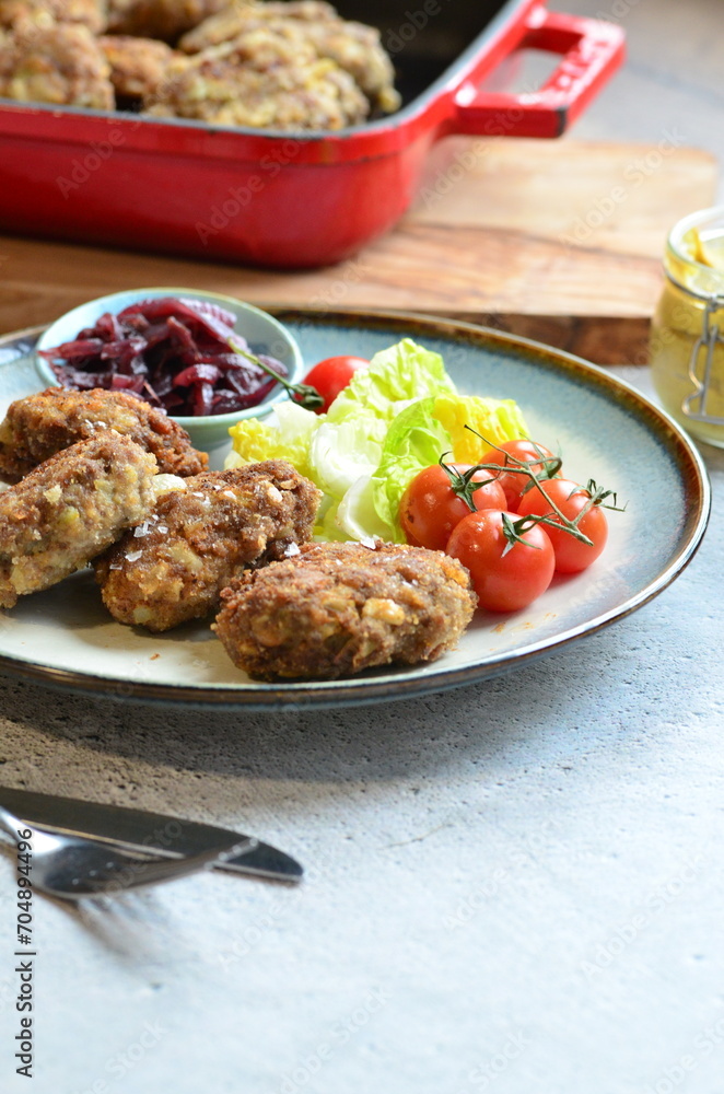 Meatballs with salad and cherry tomatoes on a plate. Selective focus. Meatballs with salad and cherry tomatoes on a plate. Selective focus.