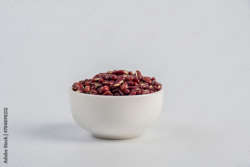 Red kidney beans in white cup on white background Red kidney beans in white cup on white background