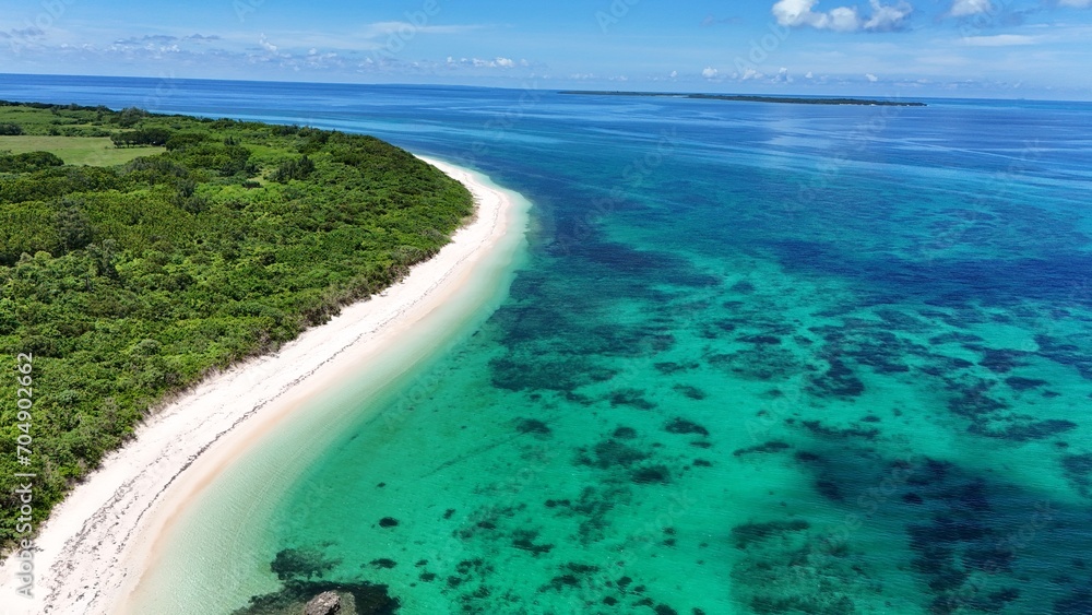 Blue lagoon and beautiful curving coastline of small island in Okinawa, Japan
