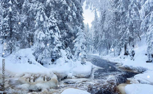 Winter landscape, landscape. The river flows in the winter forest. The rapid flow of a mountain river. Snowflakes, snowfall. Bokeh. Snow, snowdrifts. Close-up. The movement of water. Winter nature