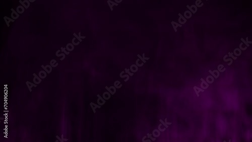 Water vapor from the humidifier on a black background, close up. Abstract flowing steam smoke with from the humidifier photo
