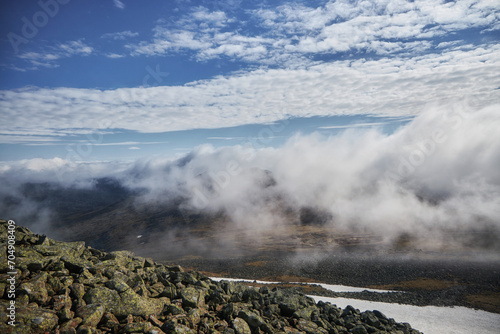 Severe weather in the Ural Mountains, Russia. Fog creeps down the mountainside, cold summer