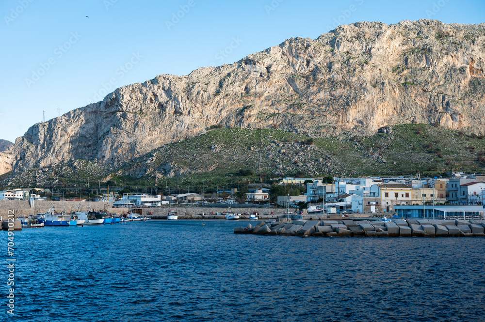 View over the village bay, the sea and the mountains in the background, Isola delle Femmine, Italy