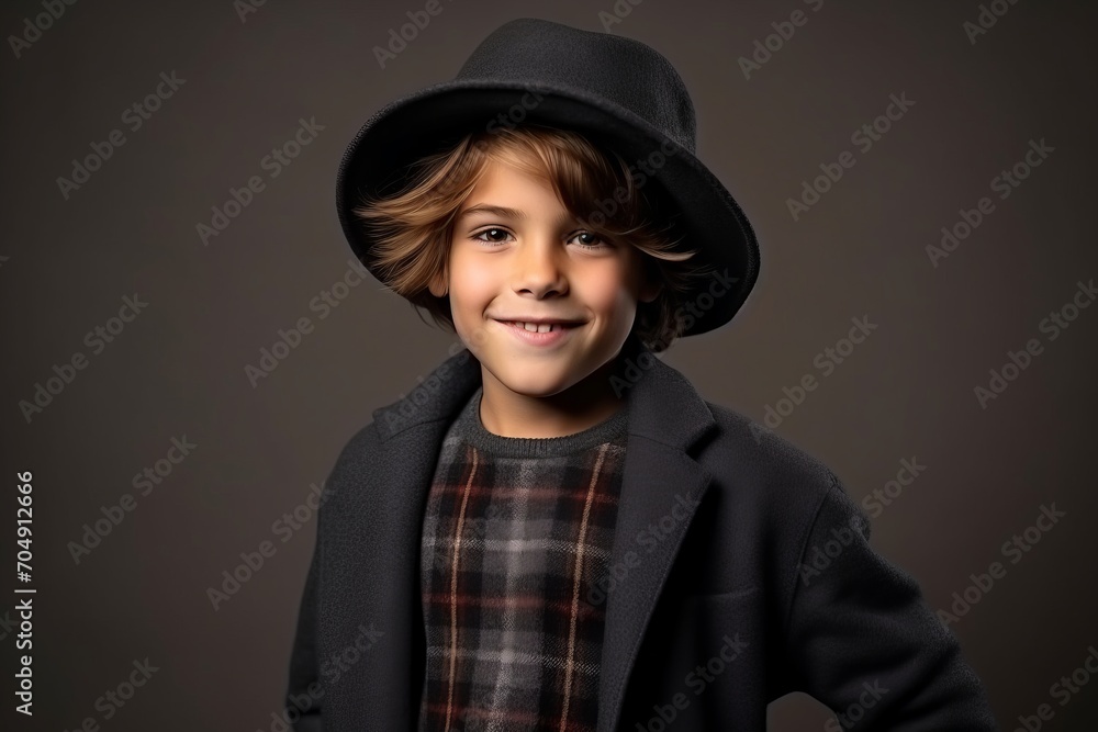 Portrait of a cute little boy in a black coat and hat Portrait of a cute little boy in a black coat and hat