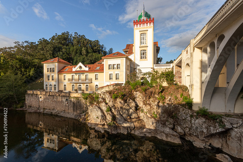 Obraz na płótnie Puente Viesgo, Spain. The Gran Hotel Balneario (Great Hotel Spa) and the bridge over the river Pas w salonie