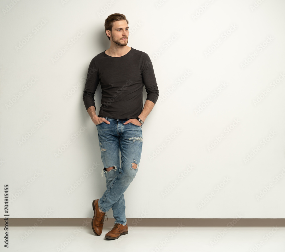 Full length portrait of happy handsome young man isolated on white background. Full length portrait of happy handsome young man isolated on white background.