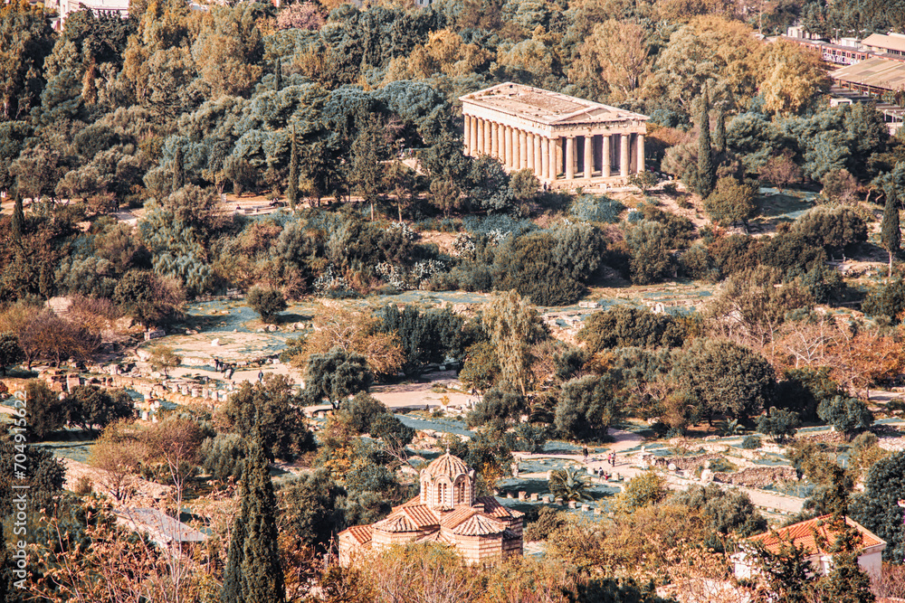 Naklejka premium Temple of Hephaestus (Hephaisteion). Aerial birds eye view photo of iconic temple on ancient Agora. Well-preserved Doric peripteral temple and byzantine Church. Toning. Athens, Attica, Greece