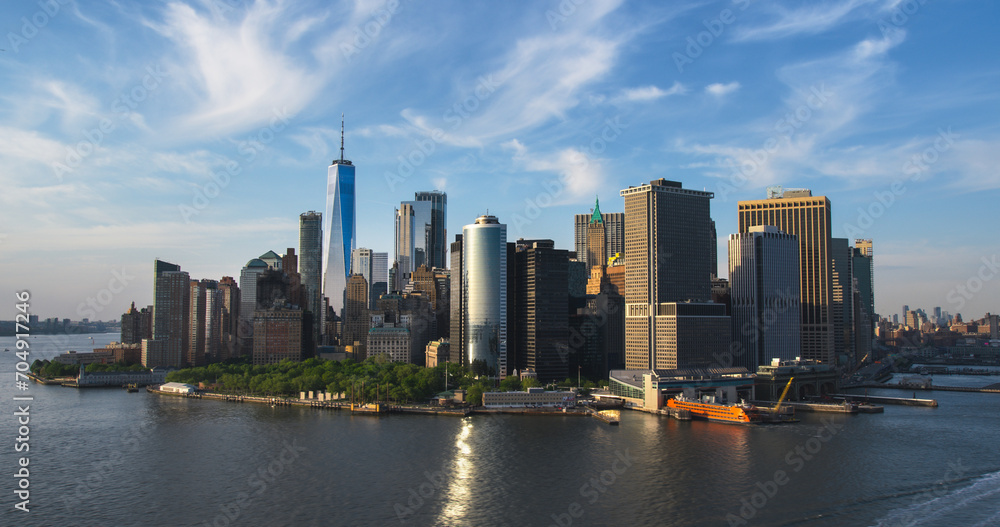Naklejka premium Scenic Aerial New York City View of Lower Manhattan Architecture. Panoramic Wall Street Financial District Photo from a Helicopter. Cityscape with Office Buildings and Skyscrapers Near East River
