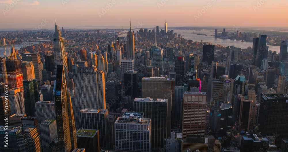 Scenic Aerial New York City Evening View of Lower Manhattan Architecture. Panoramic Downtown Image from a Helicopter at Sunset. Cityscape with Modern Office Buildings and Historic Skyscrapers