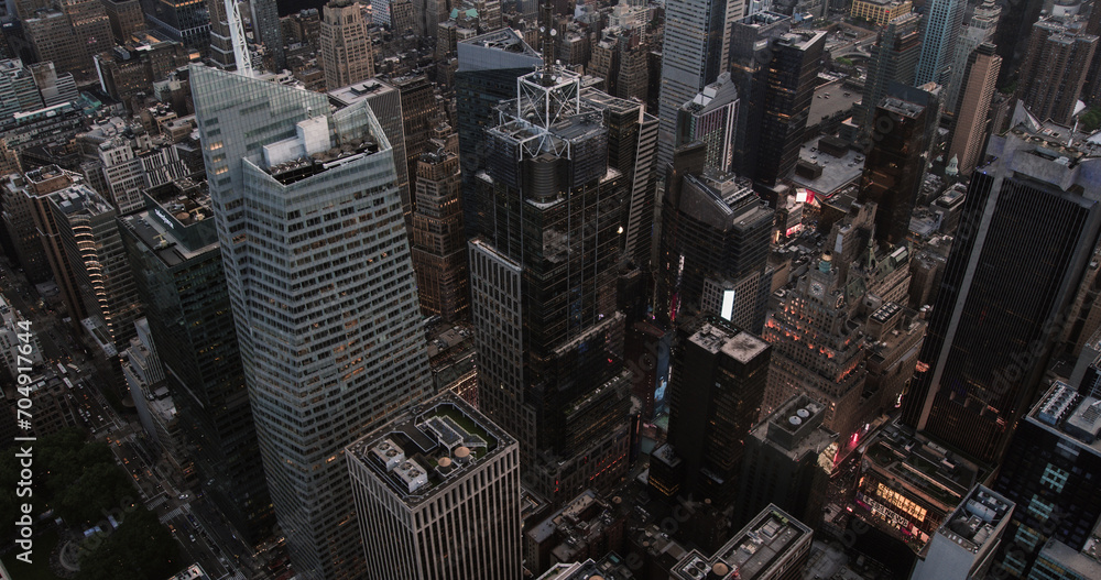 Fototapeta premium Top Down Aerial View of Times Square in New York City in Midtown Manhattan. Helicopter Flying Above the Commercial Neighbourhood, Tourist Destination and Entertainment Hub in NYC