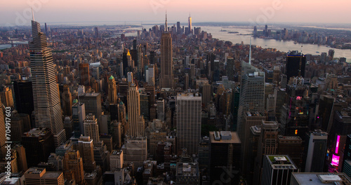 New York City Aerial Evening Cityscape with Stunning Manhattan Landmarks, Skyscrapers and Residential Buildings. Long Wide Angle Panoramic Helicopter View of a Popular Travel Destination © Gorodenkoff