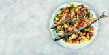 Mackerel fish baked with vegetables.