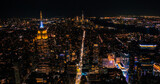 Helicopter Tour of New York City Architecture at Night. Manhattan with Panorama of Office Buildings with Lights and Congested Streets with Cars and Taxi Vehicles