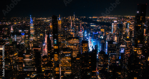 Scenic Aerial New York City View of Downtown Manhattan Architecture. Panoramic Night Photo of the Business District from a Helicopter. Cityscape with Office Buildings and Busy Traffic on Streets