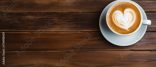 Coffee cup on wooden background.