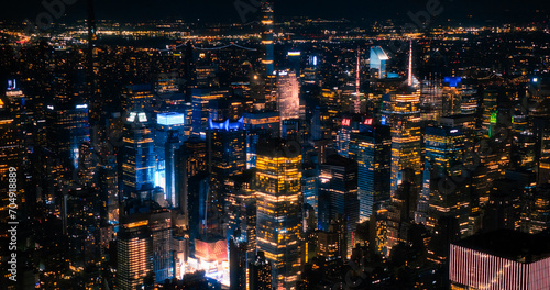 Aerial Image of Office Buildings at Night. Rooms Have Lights On, Businesspeople and Managers Working Long Hours in New York City. Helicopter Cityscape View of Manhattan in the Evening
